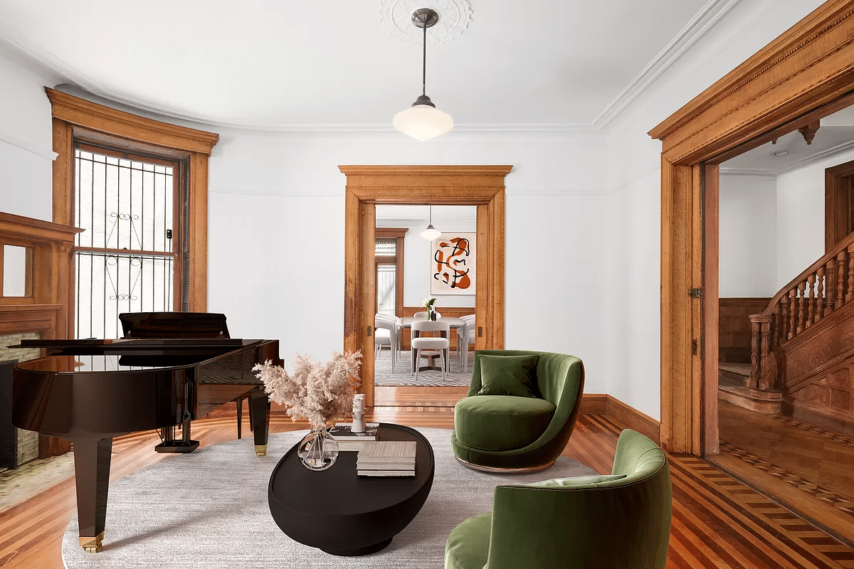 virtually staged middle parlor with mantel, pocket doors