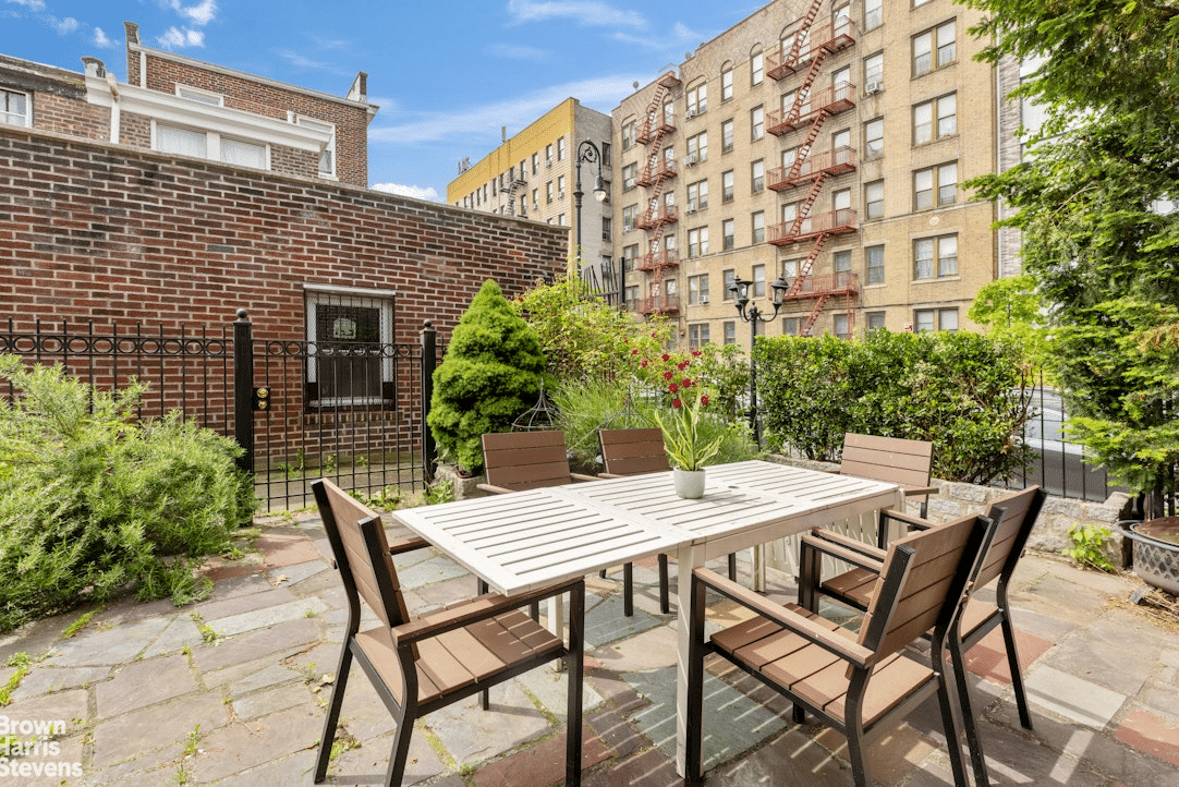 Paved garden with dining area