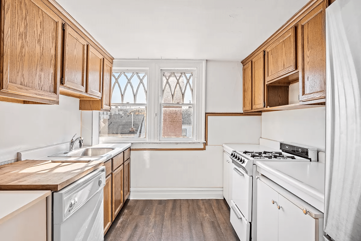 kitchen with wood cabinets and white appliances