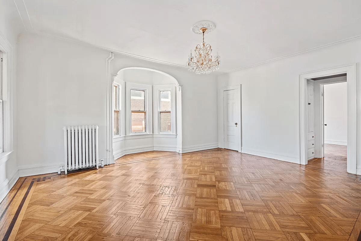 bedroom with bay window, wood floor