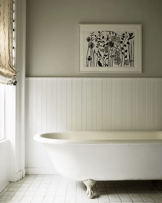 bathroom with beadboard and a clawfoot tub