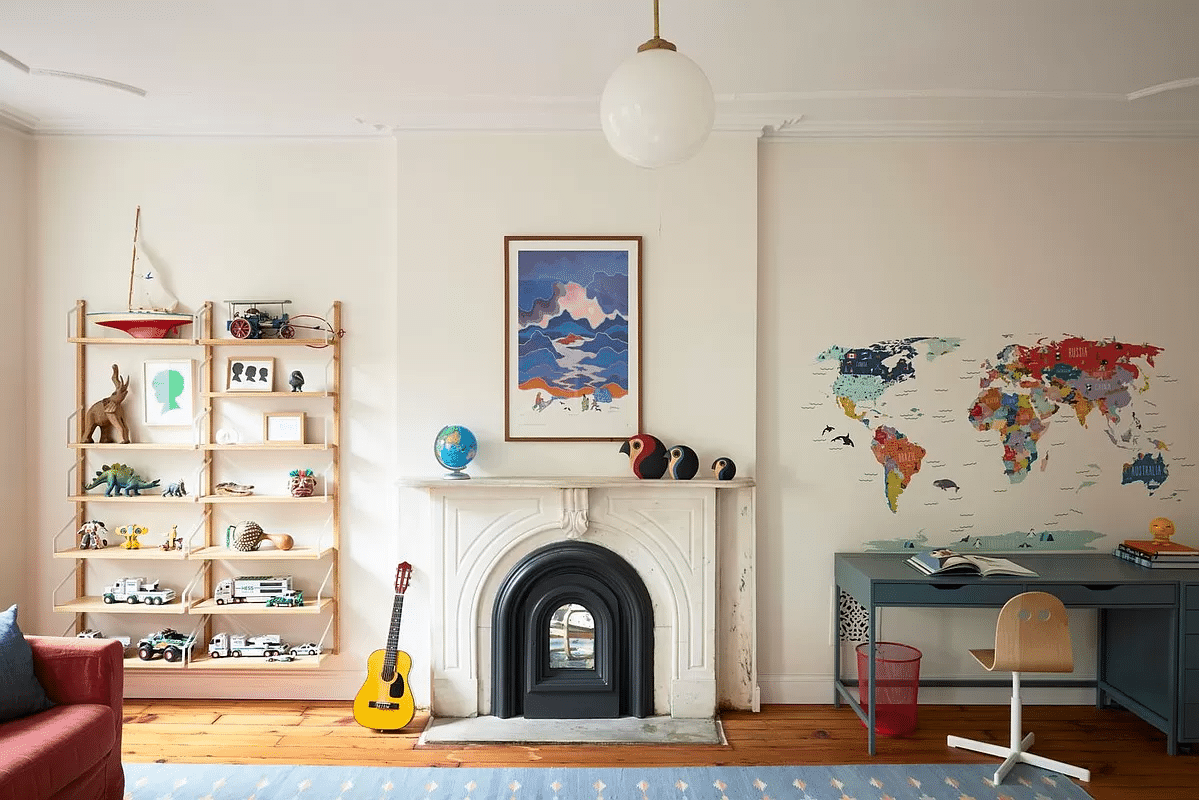 bedroom with white walls, marble mantel