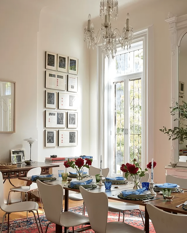 dining room with pier mirror, chandelier, and french doors to garden