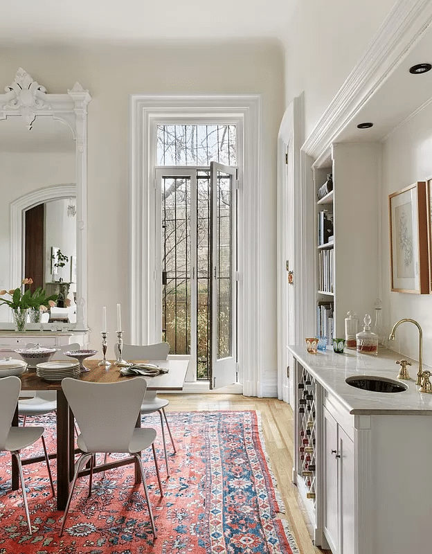 dining room with pier mirror, wet bar, french doors to garden