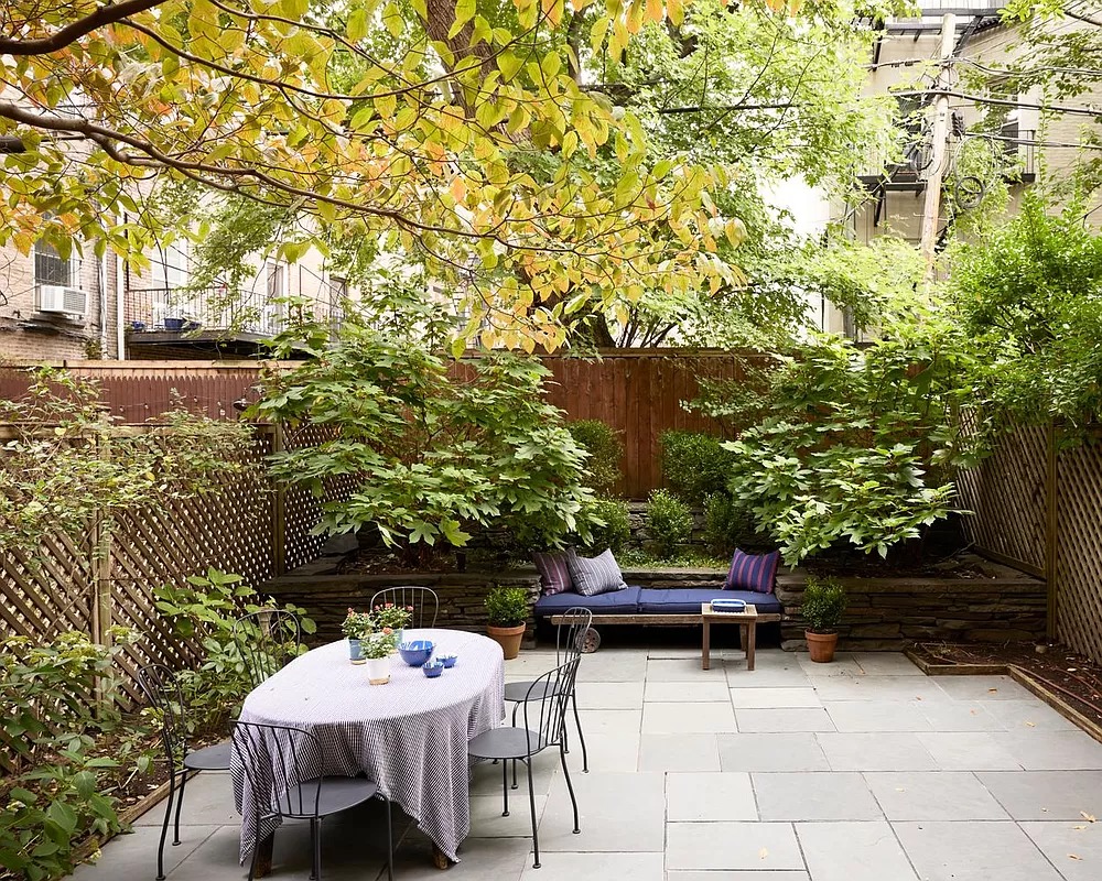 garden with paved patio, planting beds