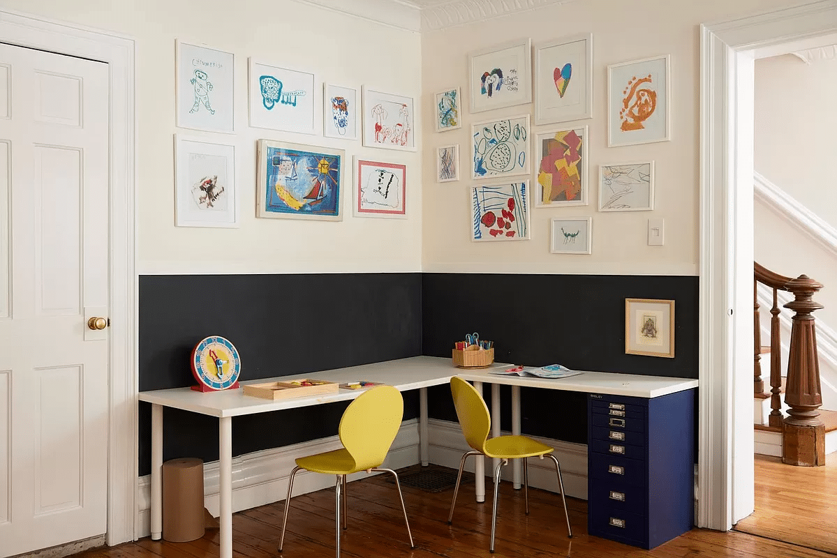 playroom set up as a office with white tables