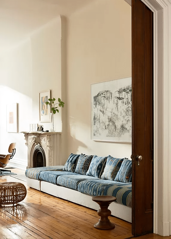 parlor with white walls, marble mantel