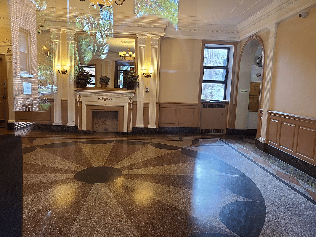 lobby with fireplace, decorative floor