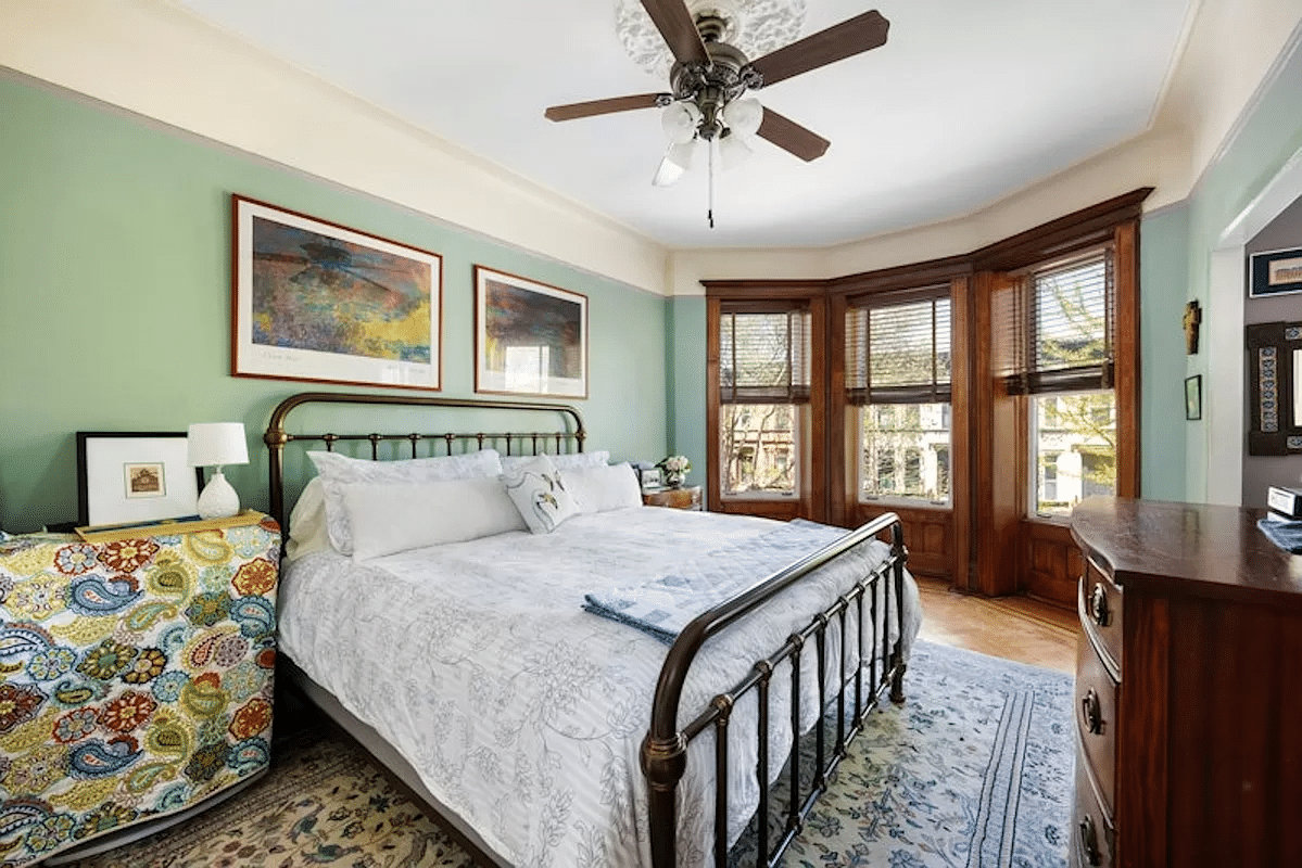 bedroom with bay window, picture rails