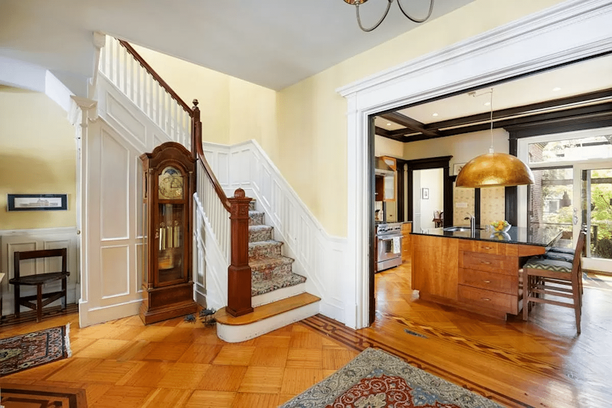 middle parlor with stair and view into kitchen