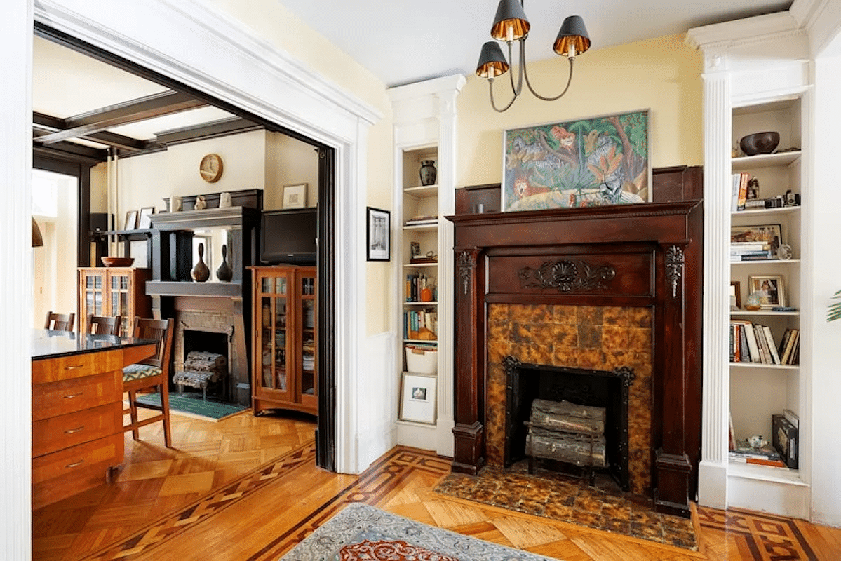 middle parlor with wood mantel and tile surround