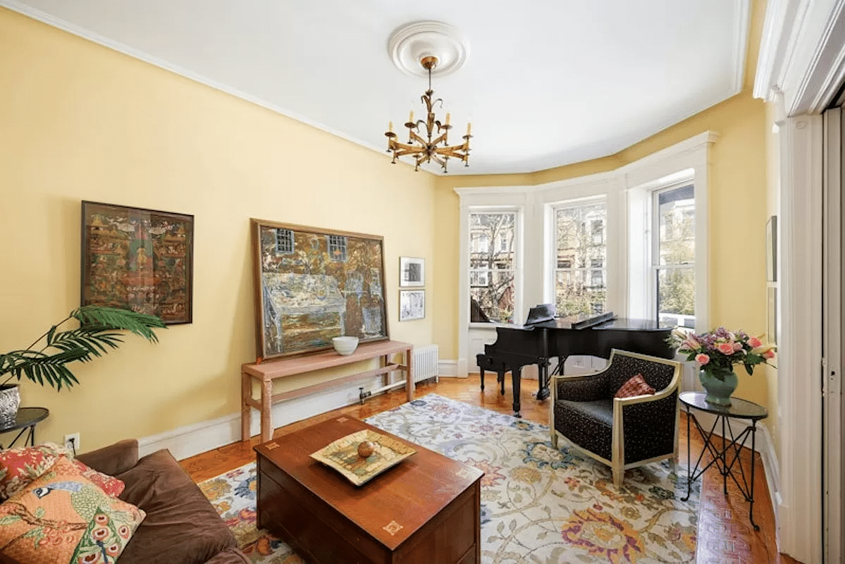 parlor with yellow walls, wood floor