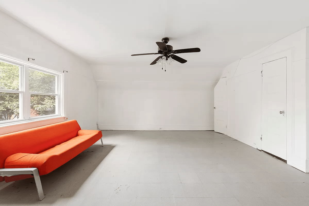 living room with ceiling fan and painted floor