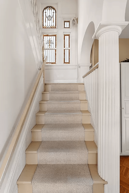 stair with stained glass on landing