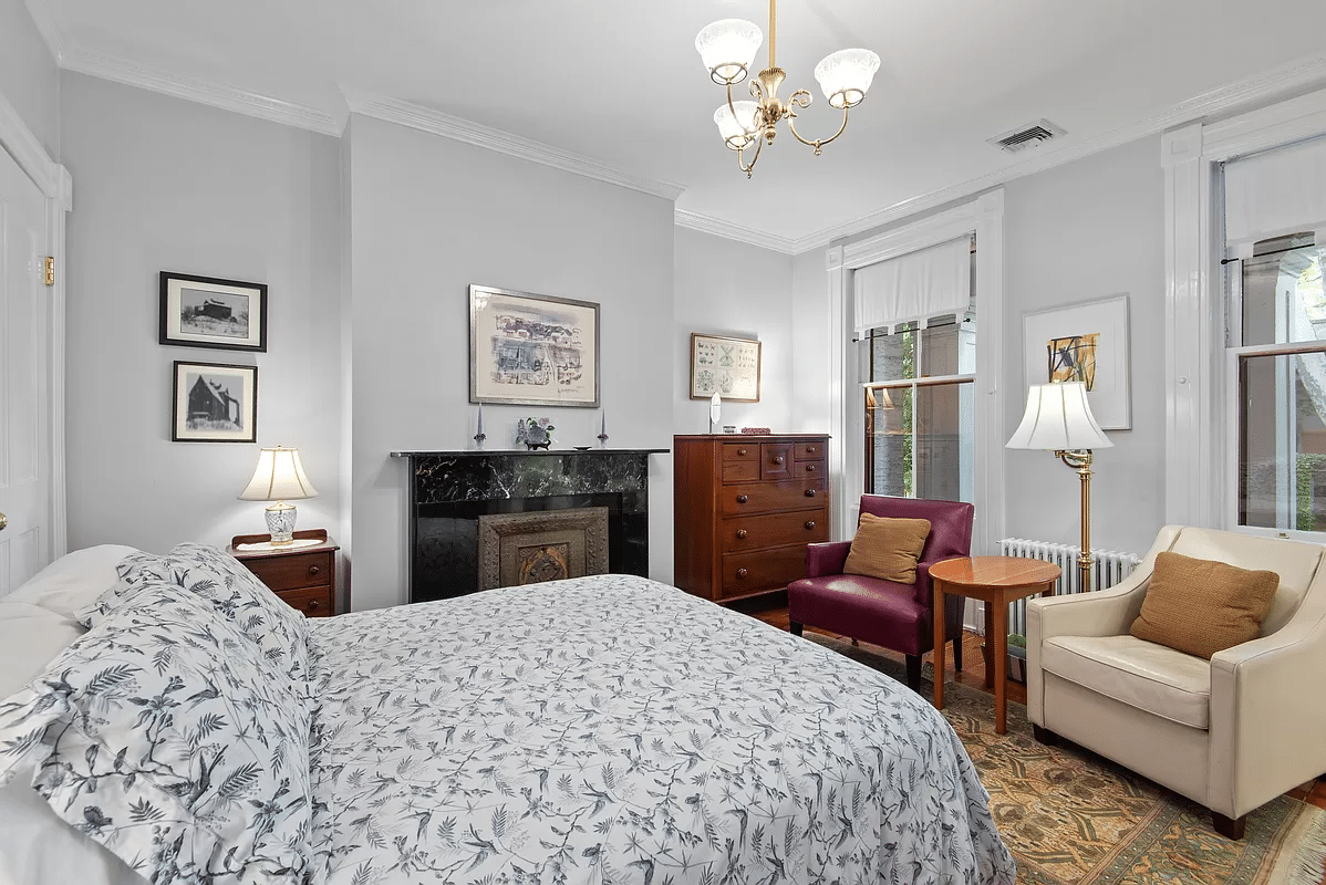 bedroom with black marble mantel