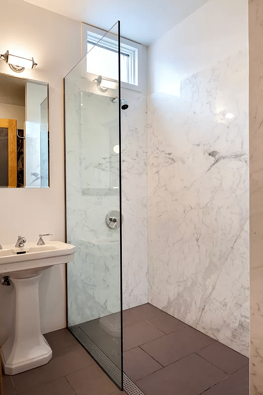 bathroom with a walk-in shower