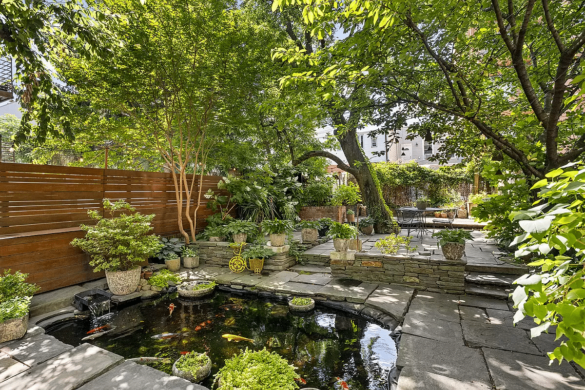 the garden with a view of the pond and the raised level at the rear of the garden