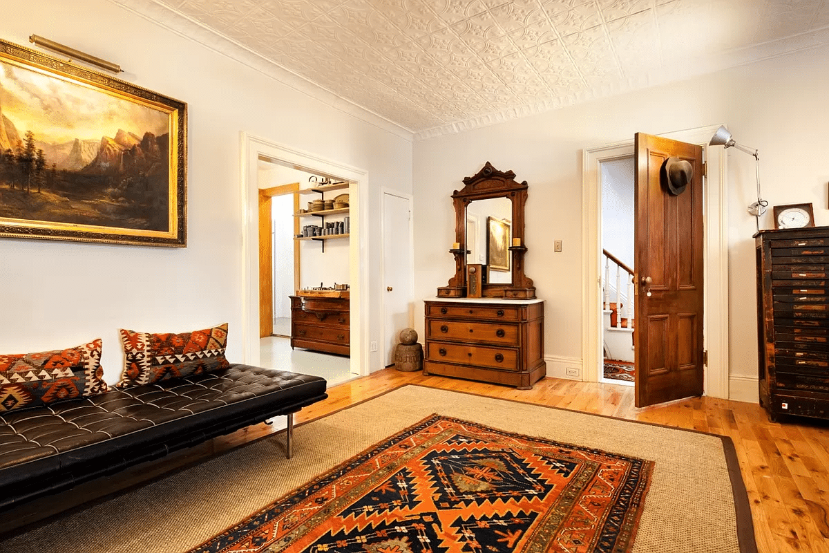 parlor with a view into the kitchen and the entrance hall