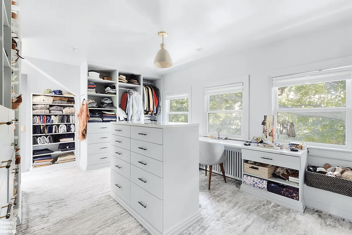 dressing room with carpet, built-in storage