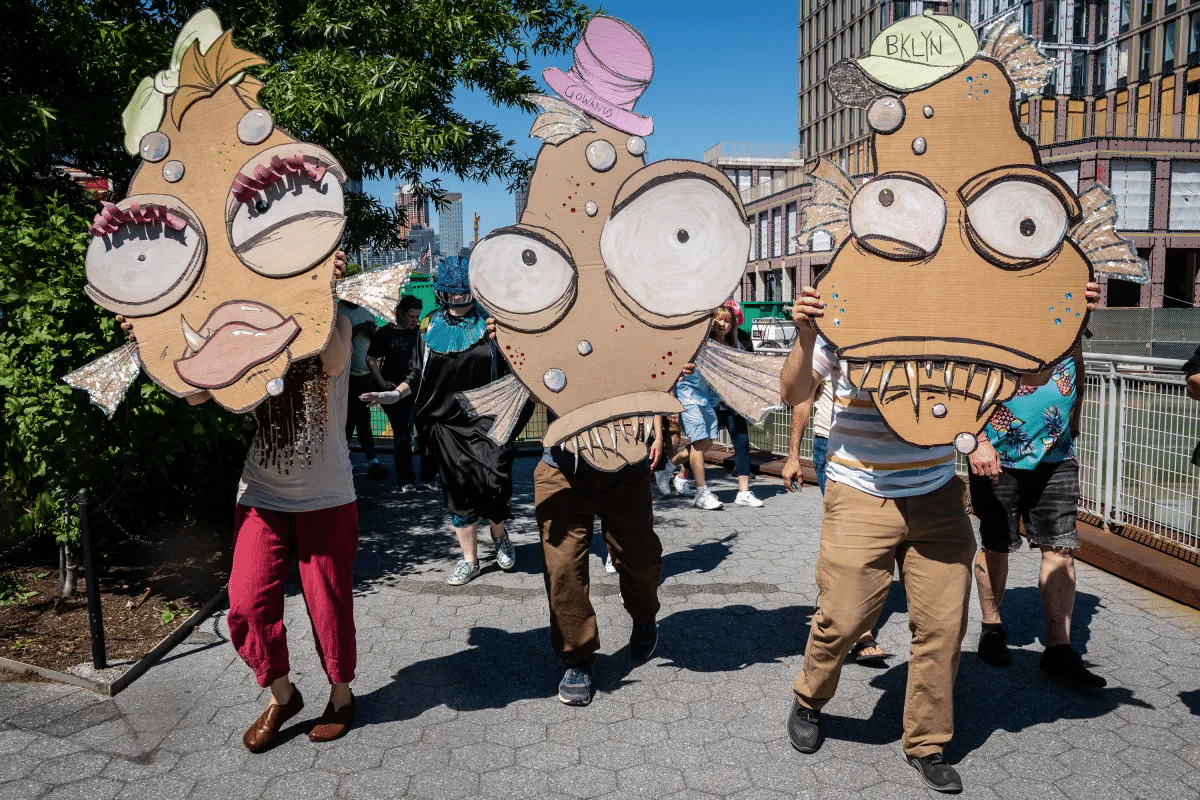 gowanus - people parading with giant creature masks