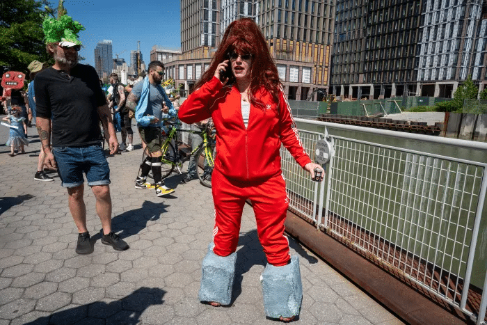 person in red track suit with "cement boots"