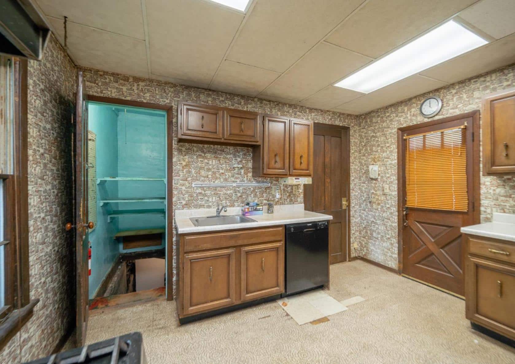 kitchen with drop ceiling, wood cabinets