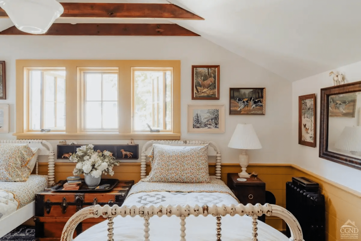 bedroom with wainscoting, trim painted mustard