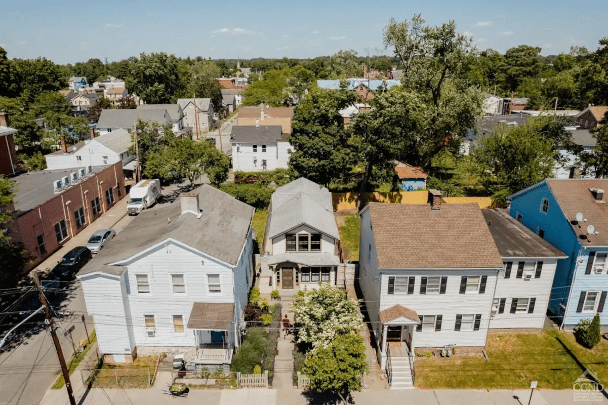 aerial showing house set back from the street with a front garden