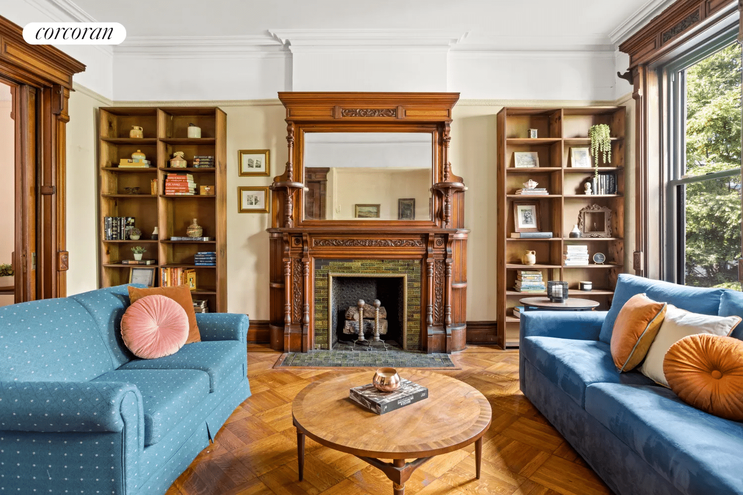 rear parlor with wood mantel with mirror