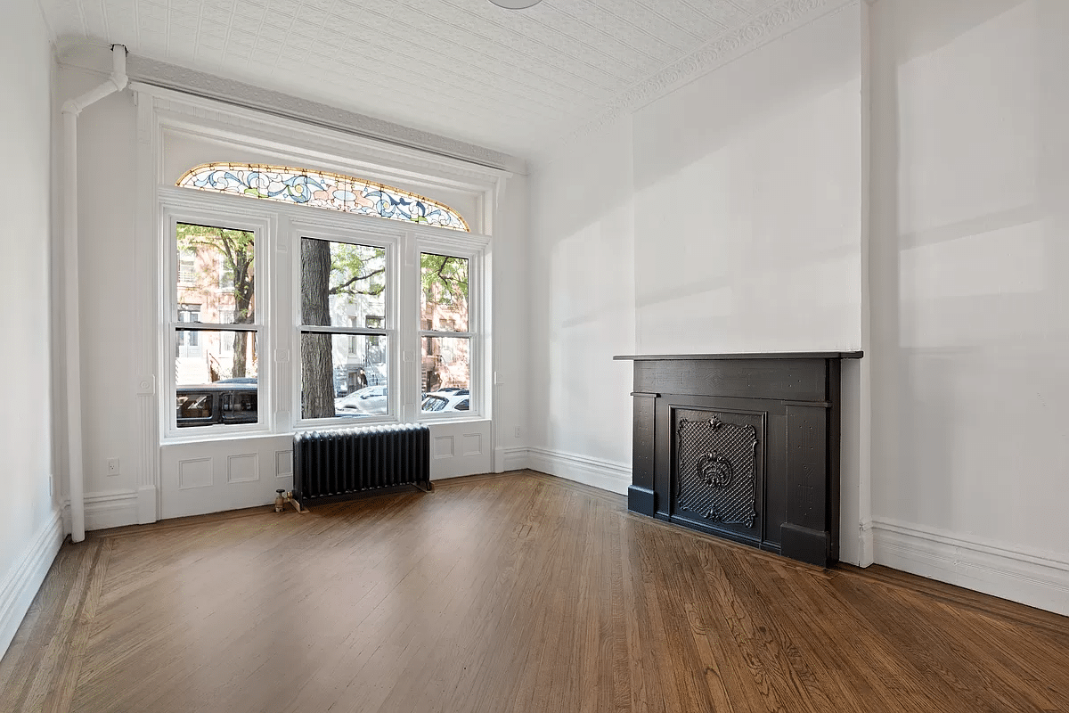 park slope - living room with wood floor, mantel, stained glass