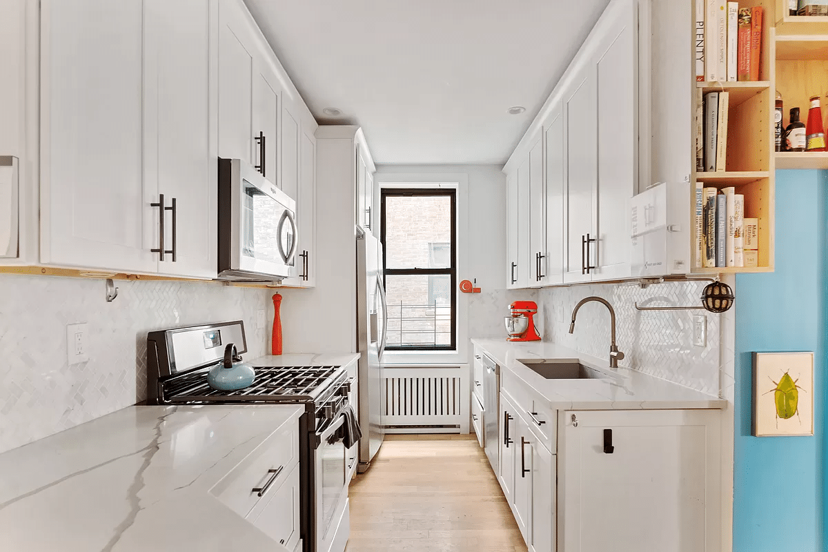 kitchen with white cabinets and counters