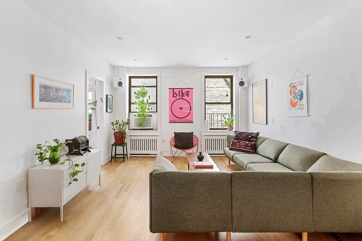 living room with wood floors, two windows