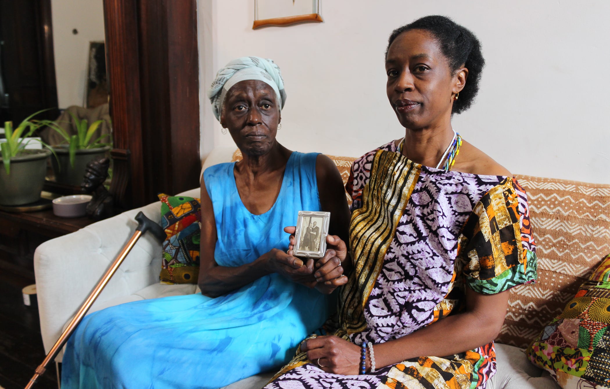 bed stuy - mother and daughter posing with a family photo