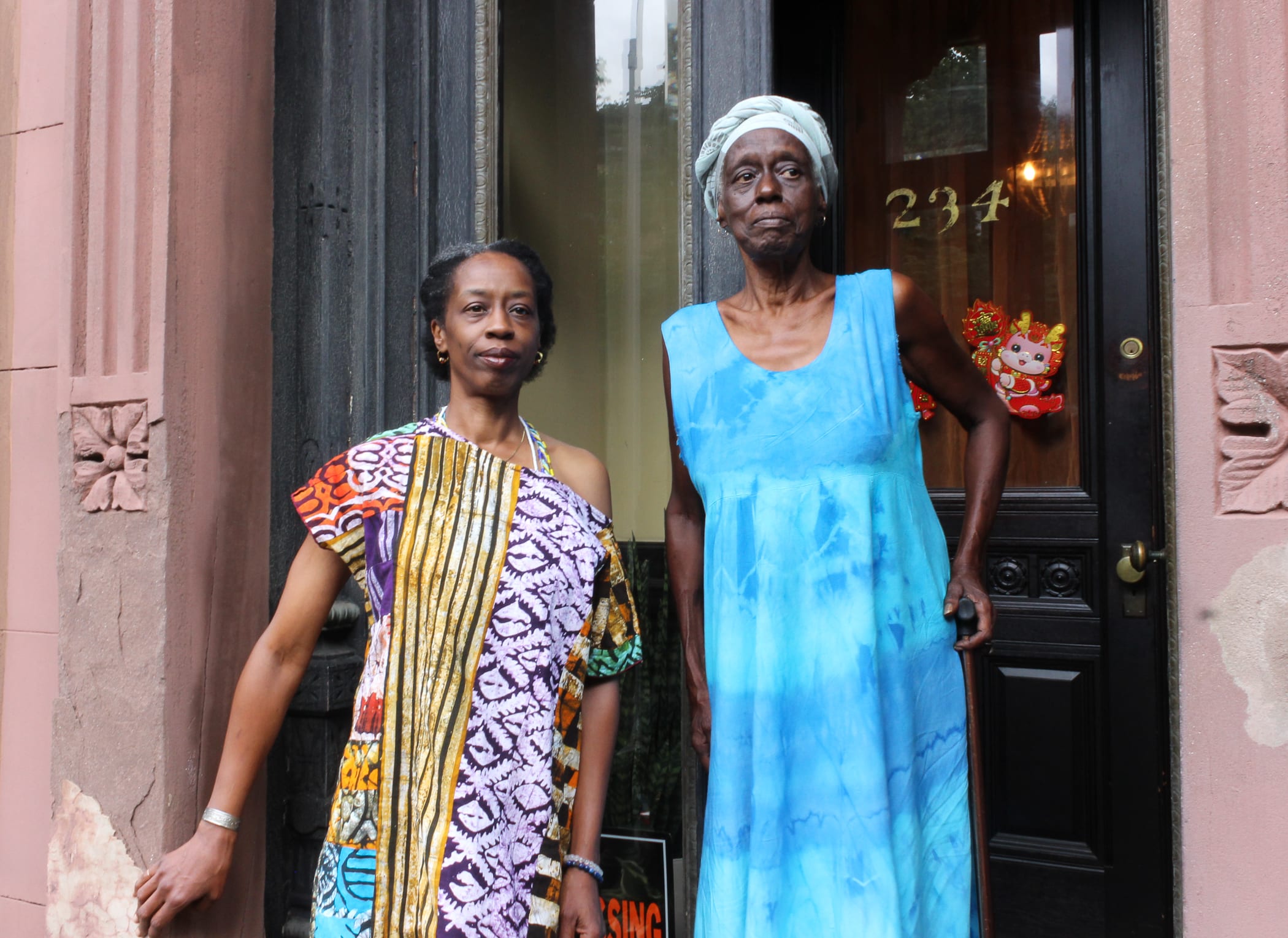 bed stuy - mother and daughter pose on the stoop