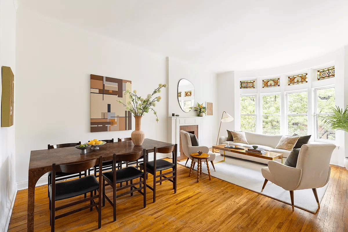 living room with dining room and fireplace