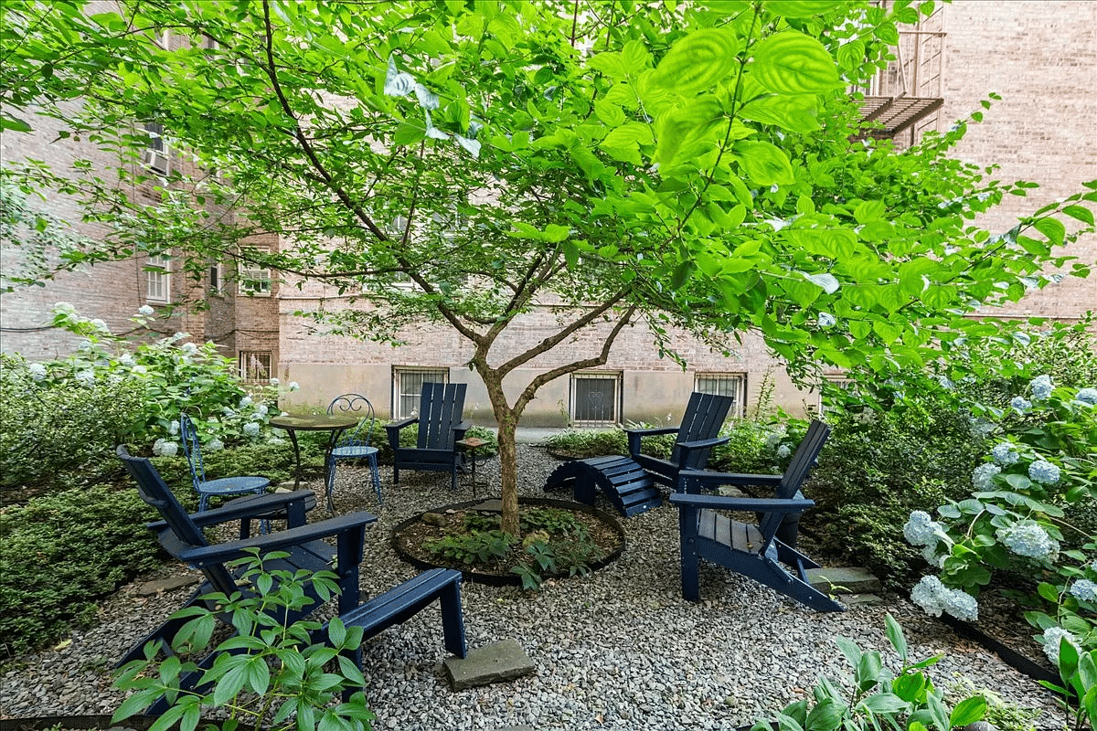 garden with gravel patio and chairs