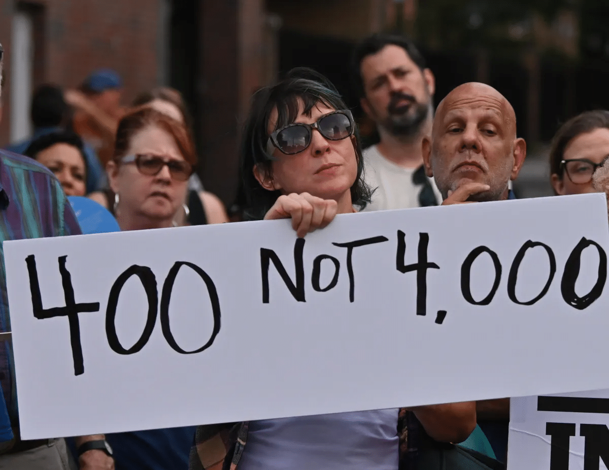 rally - people holding signs at a rally