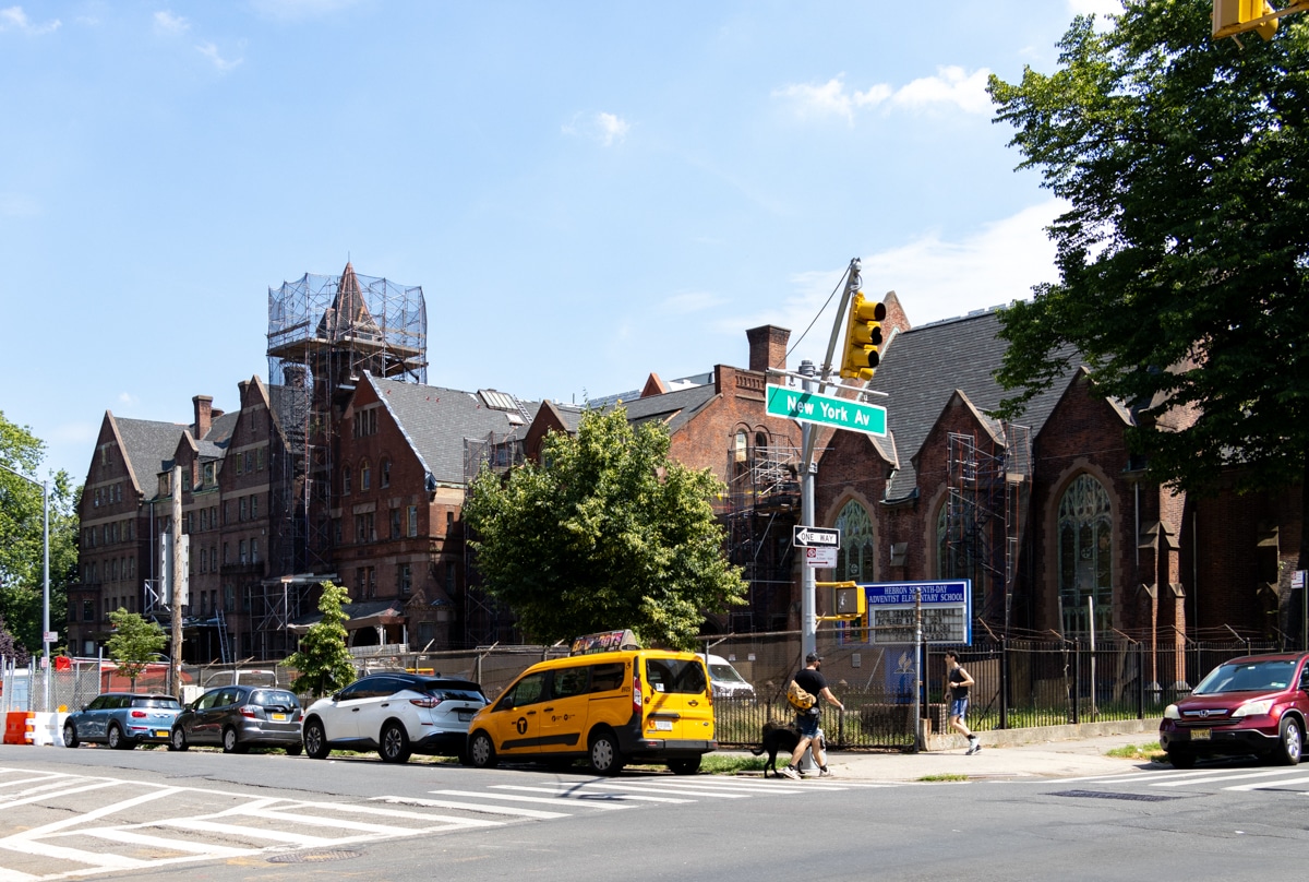 the tower of the hebron school under scaffolding