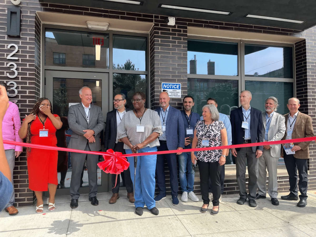 east new york - ribbon cutting in front of a building