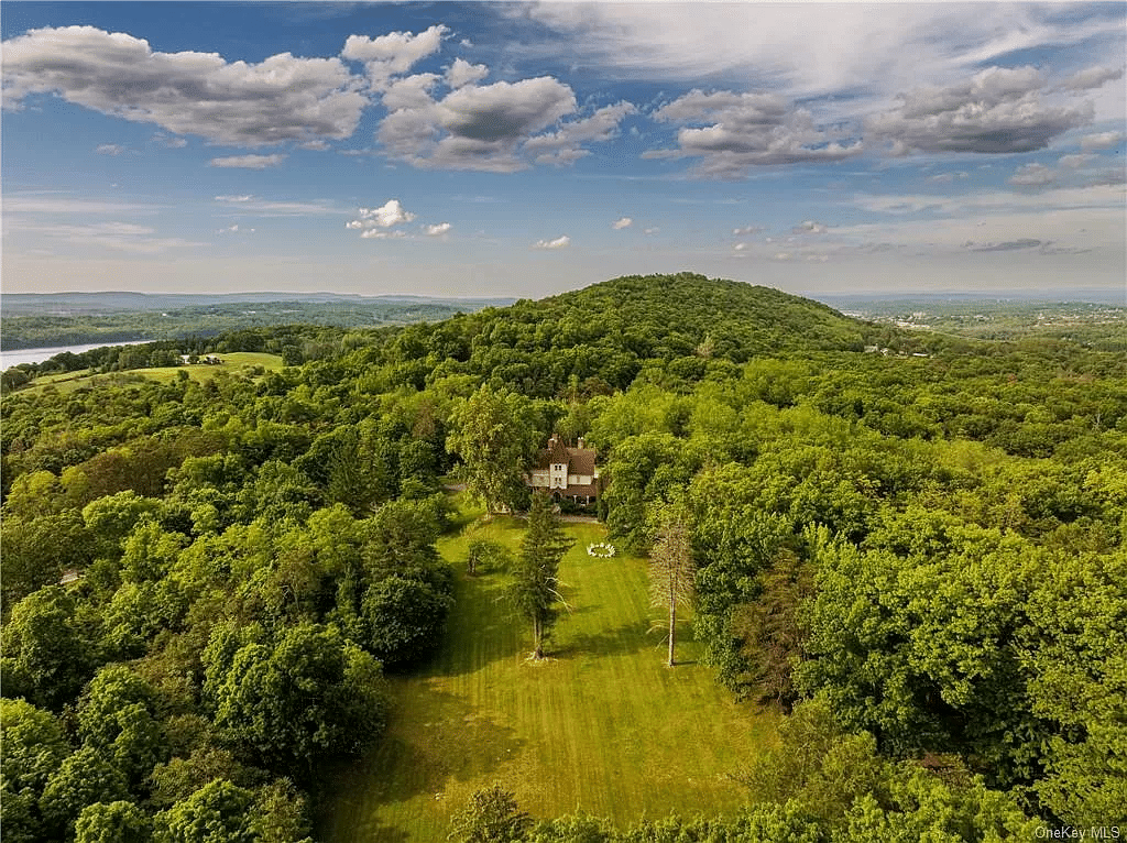 aerial view of the lawn behind the house with a glimpse of the Hudson River