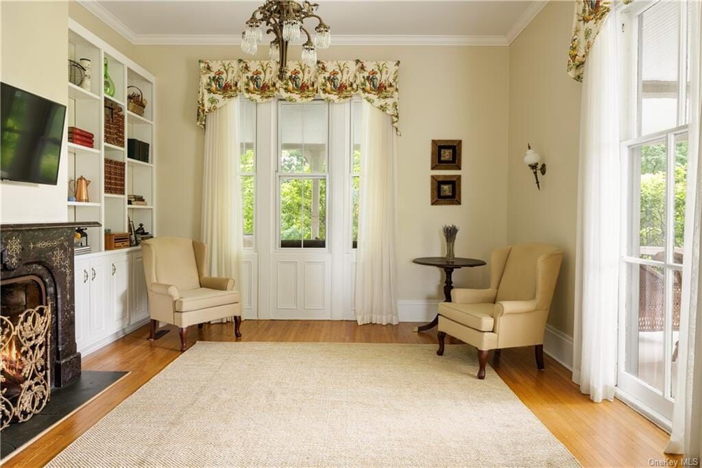 library with marble mantel, window overlooking porch