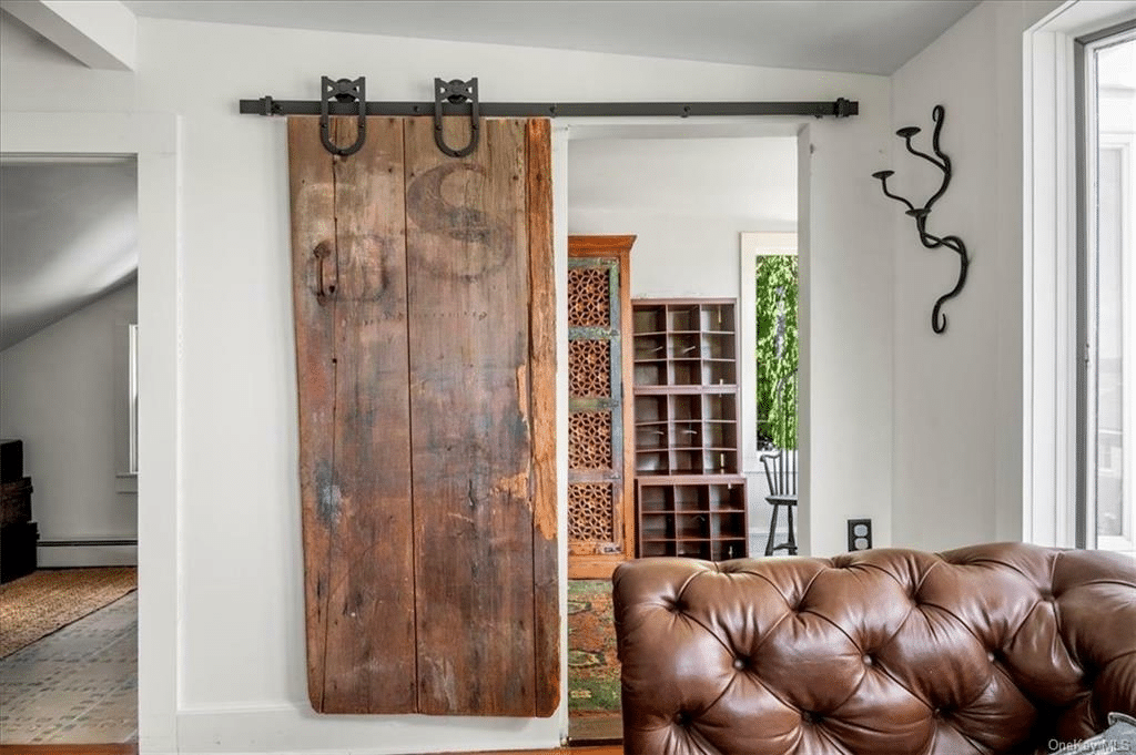 barn door between bedroom and walk-in closet