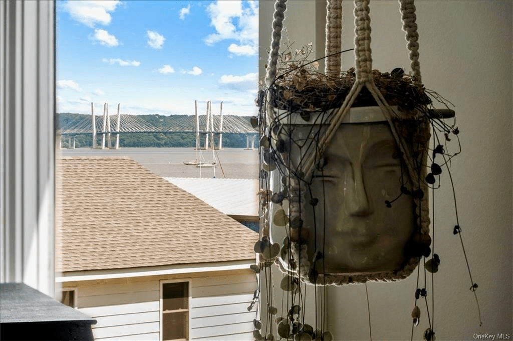 view from bedroom to water and mario cuomo bridge