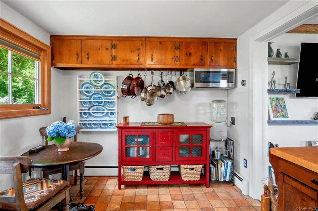 kitchen with terra cotta tile floor and room for a small table