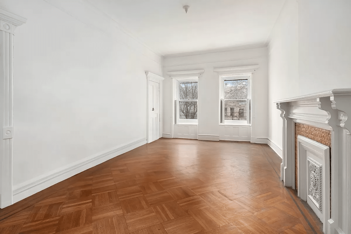 bedroom with white mantel with insert