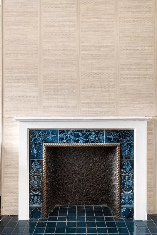 mantel with blue surround tile