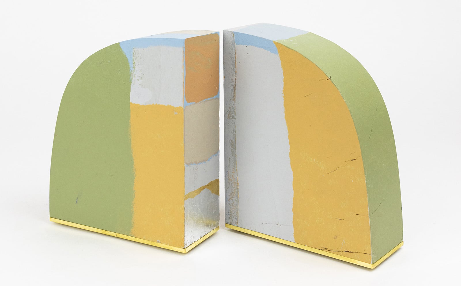 green, yellow and white curved bookends