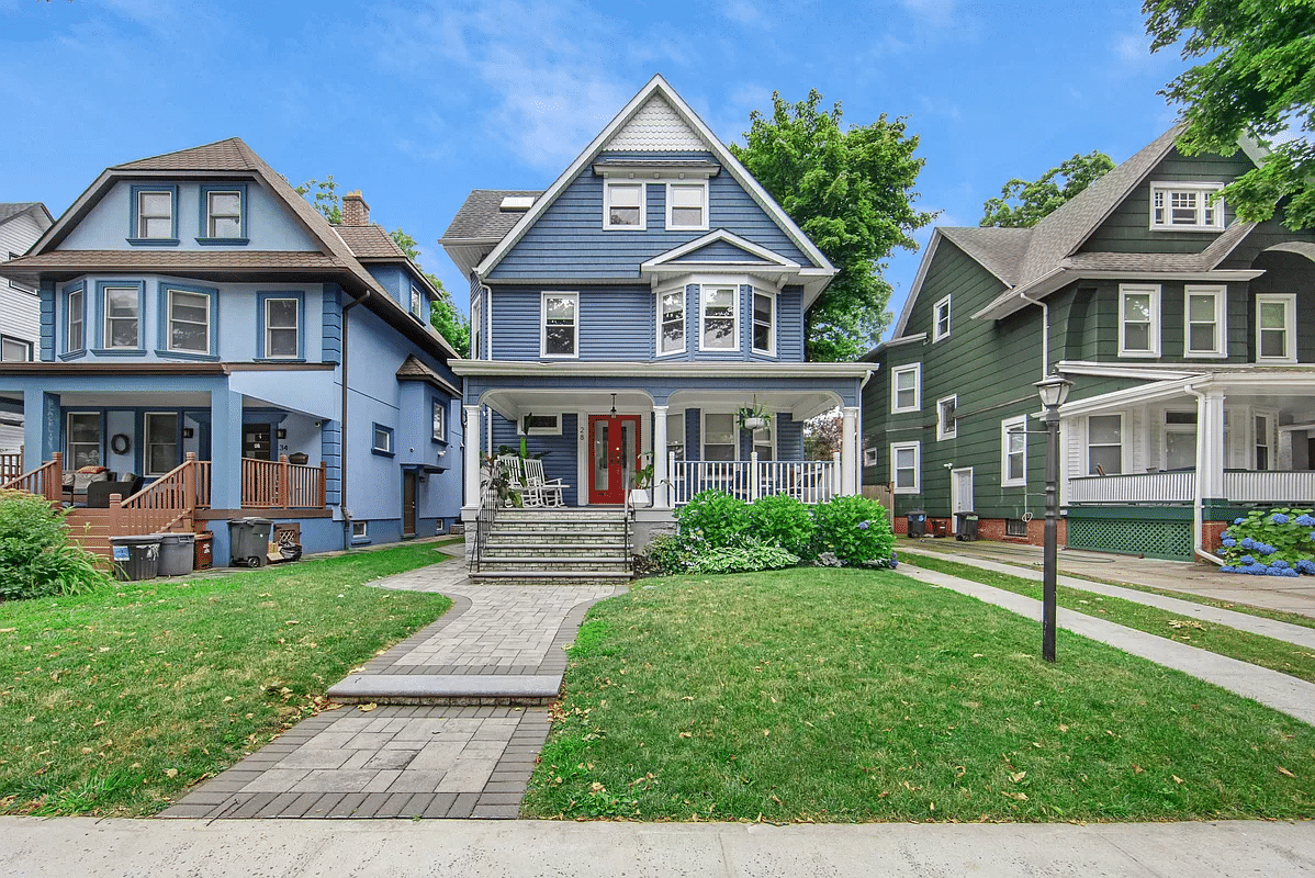 brooklyn - wood frame standalong painted blue with a red door