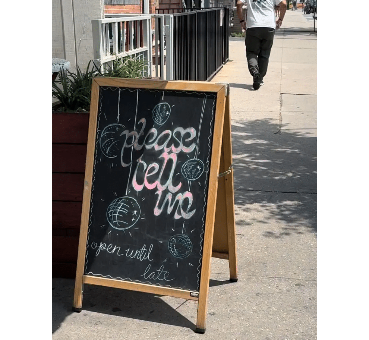 sandwich board with name of restaurant