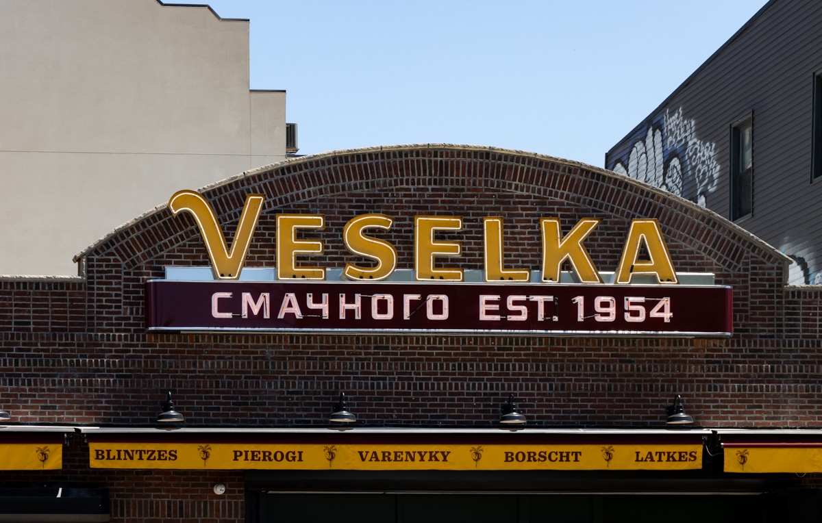 the yellow veselka sign on the top of the building